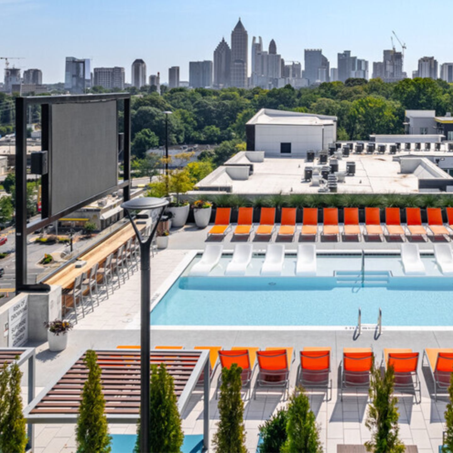 An outdoor TV and swimming pool