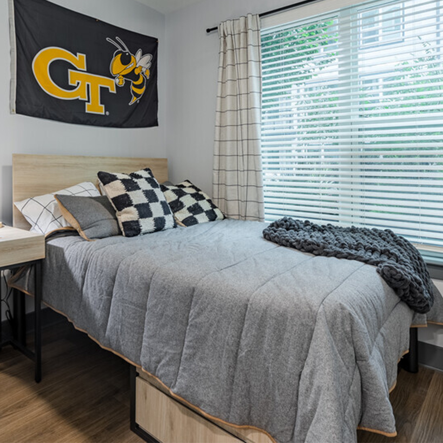 A bedroom with a GT flag